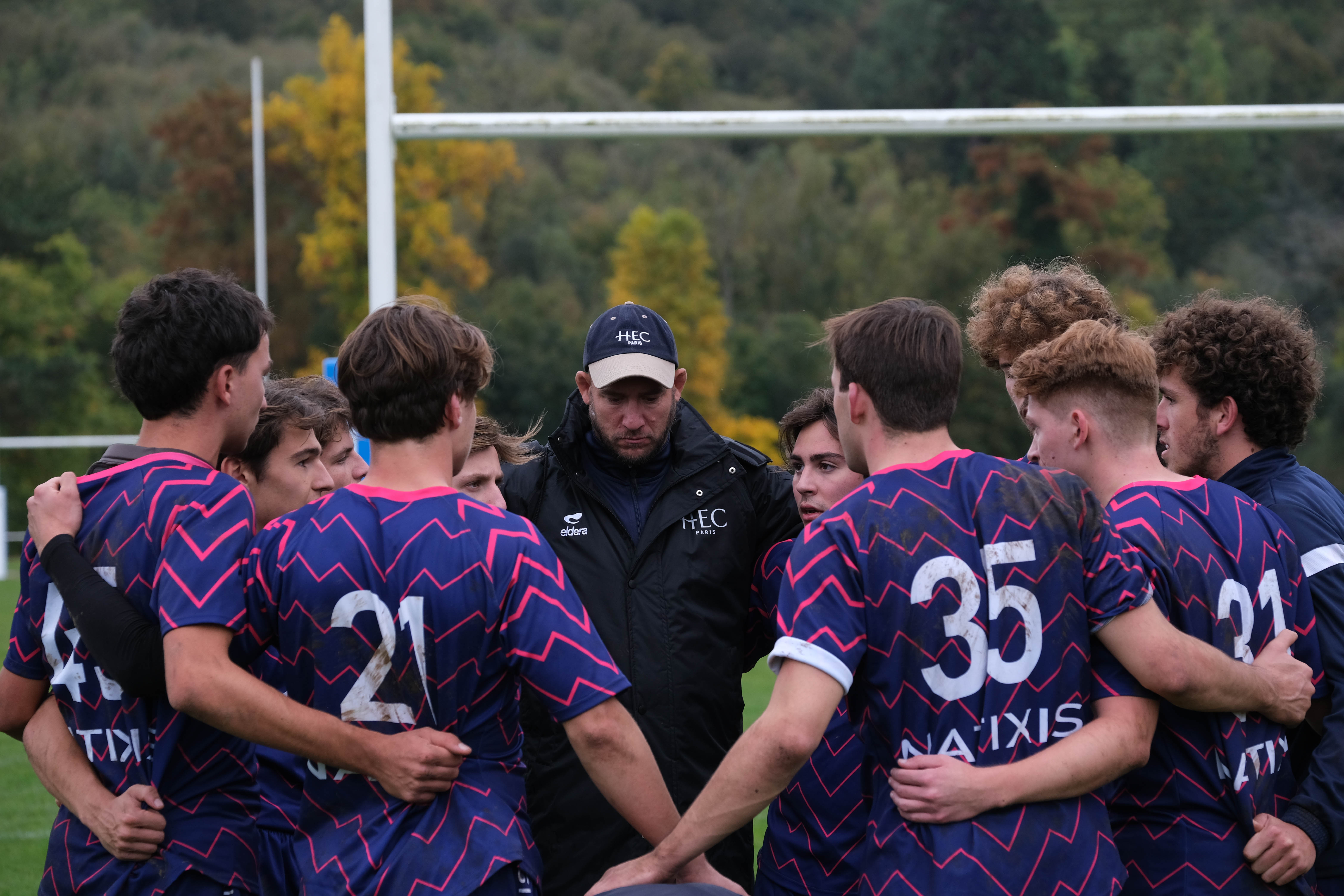 HEC students and a rugby coach on Campus